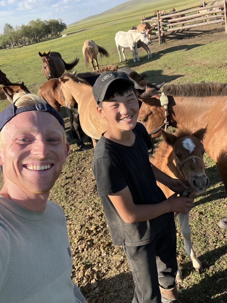 helpinig out horseman in mongolia