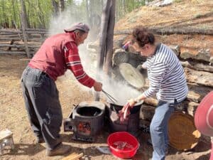 Traditional coconut processing in a forest environment.