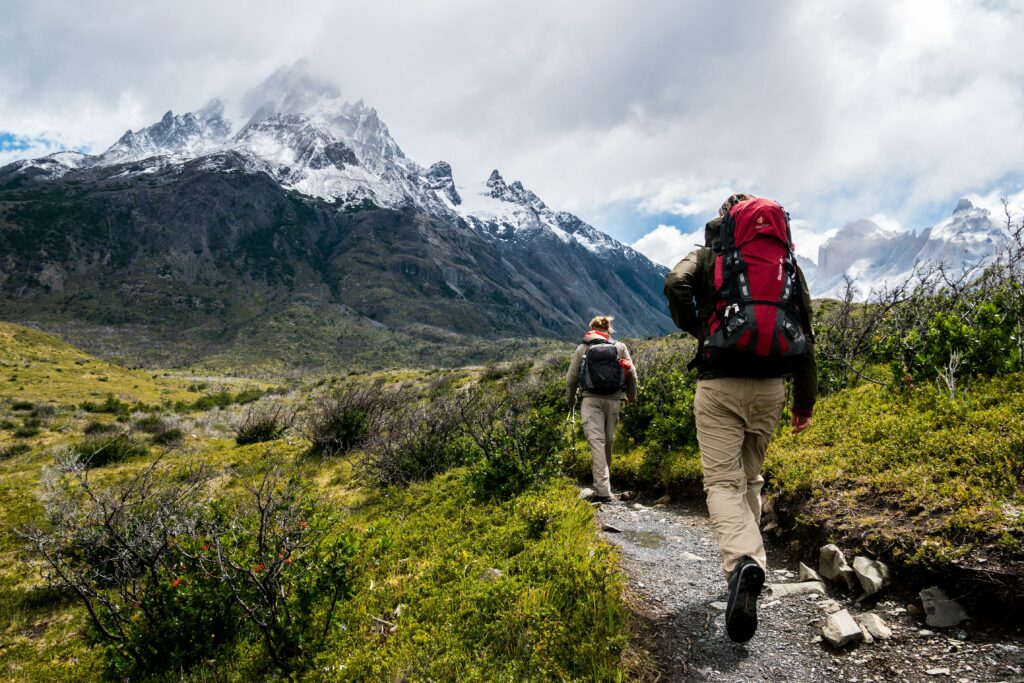 walking in the alps with backpack on
